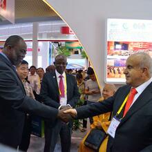 Minister of Trade, Ghana shaking hands with Chairman of WTCA