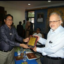 Mr. Jayant Ghate receiving momento 